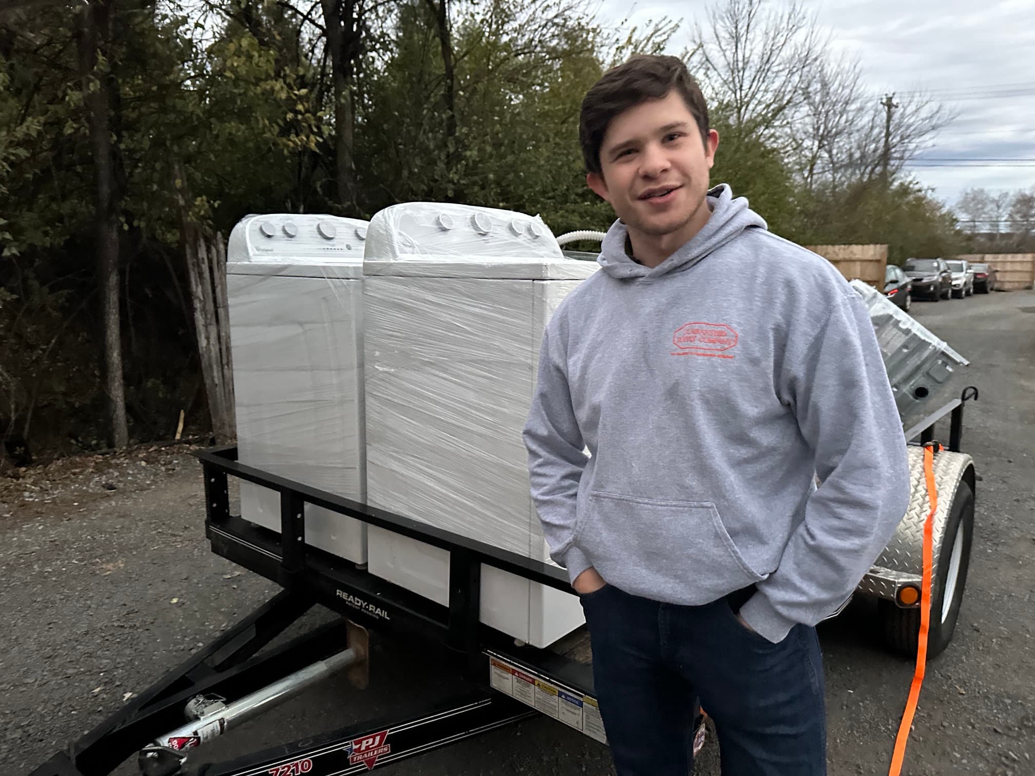 Loading freshly wrapped washers onto the delivery trailer